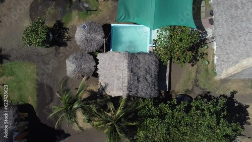 El Paredon, a charming coastal surfer village, enjoys sunlight. Rustic huts, black sands and amazing waves. A slice of tropical paradise on the shore of the Pacific Ocean in Guatemala.