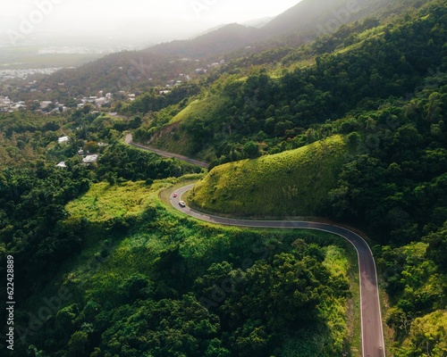 Beautiful green mountain curve road landscape of a drone capture from puerto rico