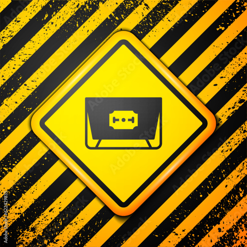 Black Blade razor icon isolated on yellow background. Warning sign. Vector