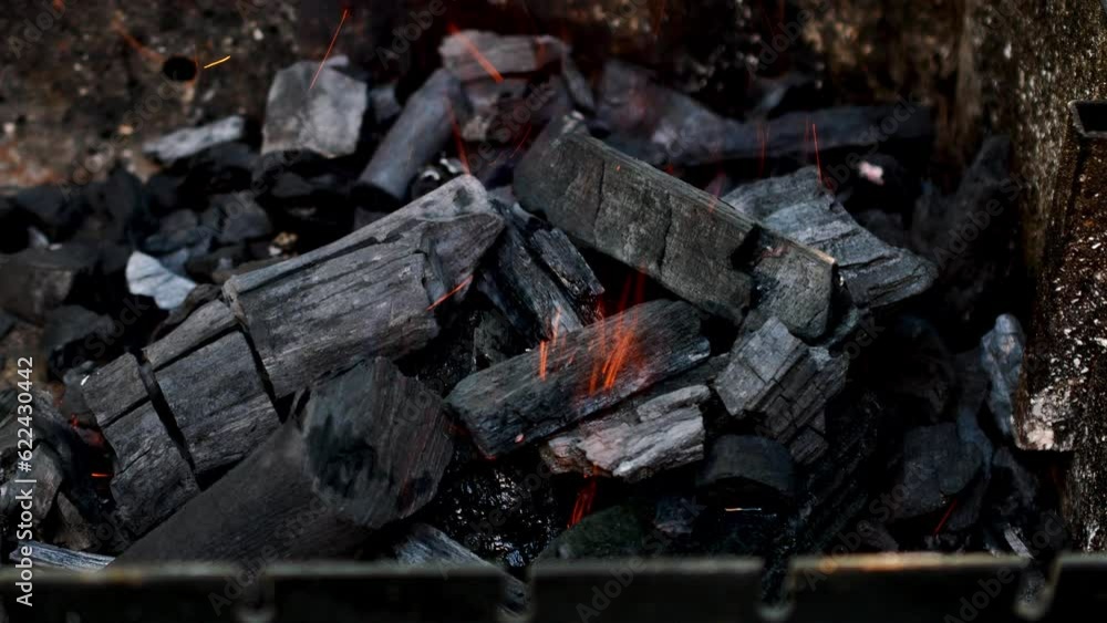 Charcoal burning in grill with bright flame. Charcoal burning in grill with bright flame.