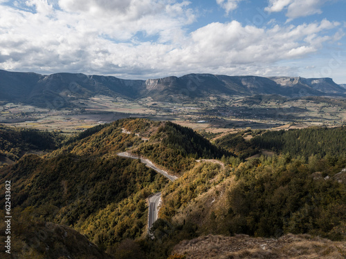 Landscape of the winding road of the port of Barrerilla with the city of Orduña deep in the valley of Arrastaria and the Gorobel mountain range behind. photo