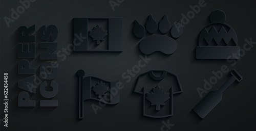 Set Hockey jersey, Beanie hat, Flag of Canada, Paddle, Bear paw footprint and icon. Vector