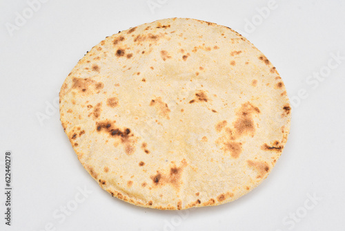 Closeup of tawa roti isolated on white background, wheat chapati photo