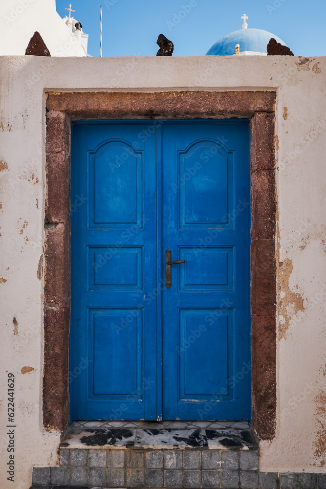 Wooden Blue Door Entrance to a Traditional House In Megalochori Village - Santorini Island, Greece - Travel Destination, Summer, Sunset