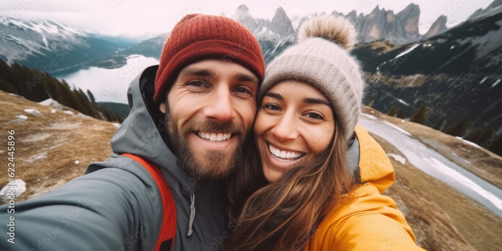Selfie photo of happy smiling cute couple hikers during traveling together at beautiful destination in the mountains Selfie photo of happy smiling cute couple hikers during traveling together at beautiful destination in the mountains