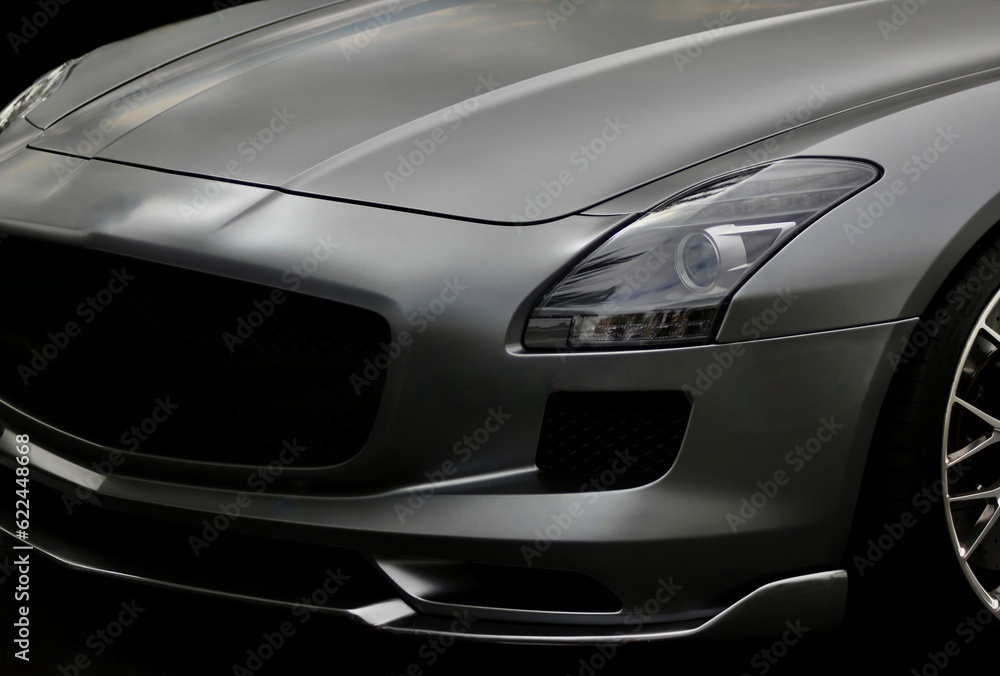 Silver sports car on black background. Elegant exotic supercar