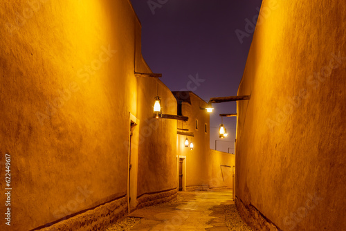 Diriyah old town traditional street illuminated at night, Riyadh, Saudi Arabia photo