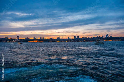 Illuminated architecture Dolmabahce Palace. Night view of istanbul city and skyscrapers. Awesome Panoramic view of Istanbul Bosphorus on night.