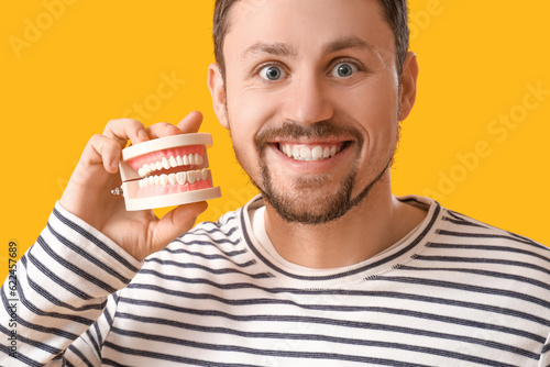 Young bearded man with jaw ...