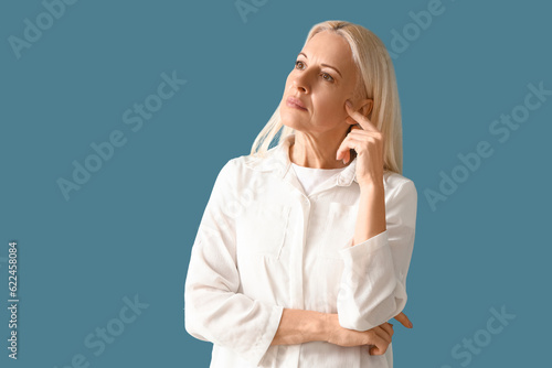 Thoughtful mature woman on ...
