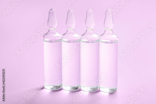 Medical ampules on lilac ba...