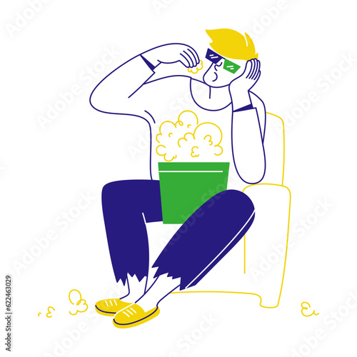 man eating popcorn at movies