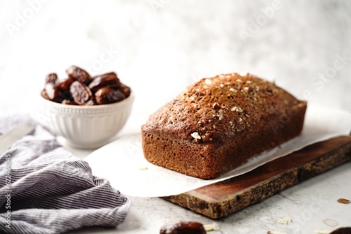Fototapeta Homemade healthy date nut bread loaf, selective focus