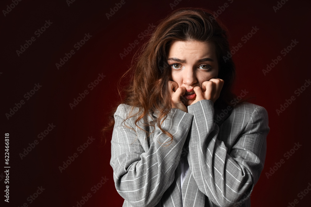 Young woman having panic attack on dark background Young woman having panic attack on dark background