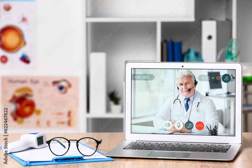 Video chat with doctor on modern laptop in clinic Video chat with doctor on modern laptop in clinic