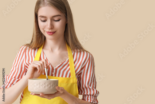 Young woman in yellow apron...