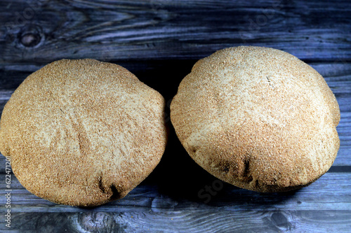 Egyptian brown bran thin crispbread bread, puff thin, crispy and delicious, eaten alone or with anything, brown circular, crunch and round baked bran whole grain breads, selective focus