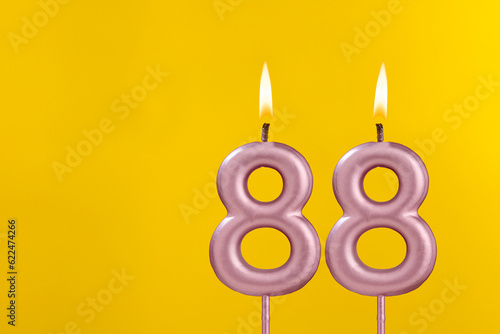 Birthday candle number 88 - Birthday celebration on yellow background
