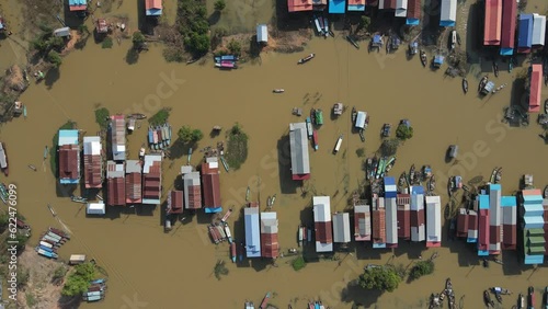 Floating village on a river, Kampong Phluk, Cambodia, Boats, fisherman, 4k Drone footage