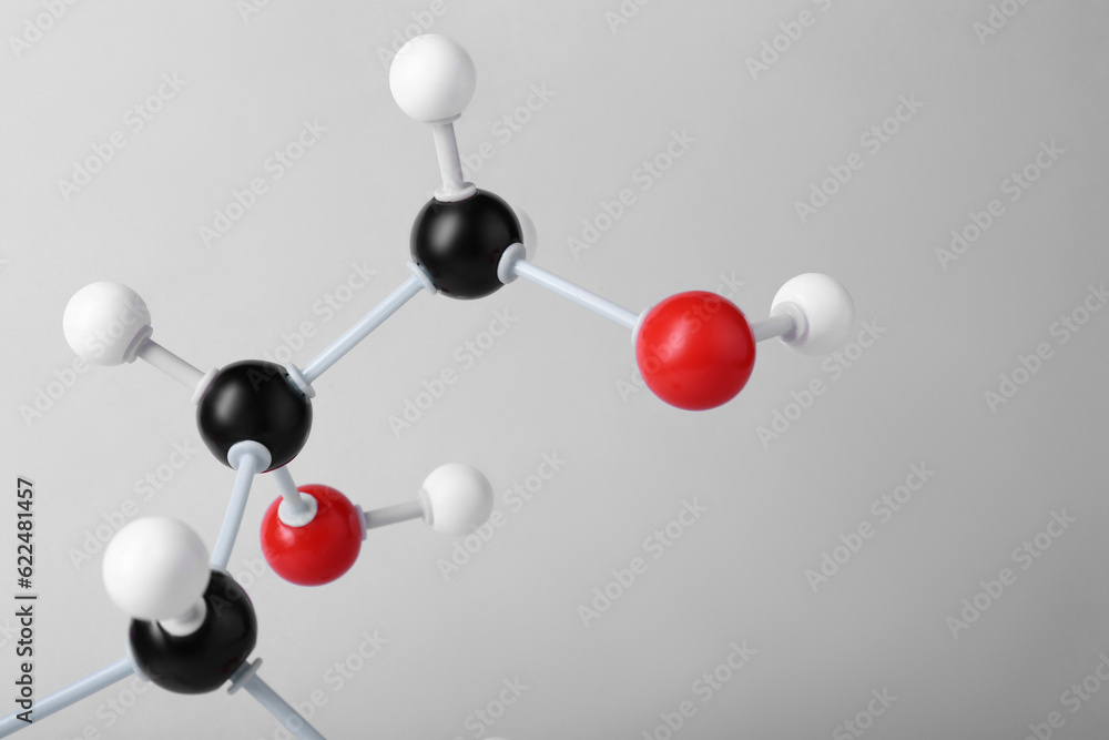 Fototapeta premium Molecule of glucose on light grey background, closeup. Chemical model