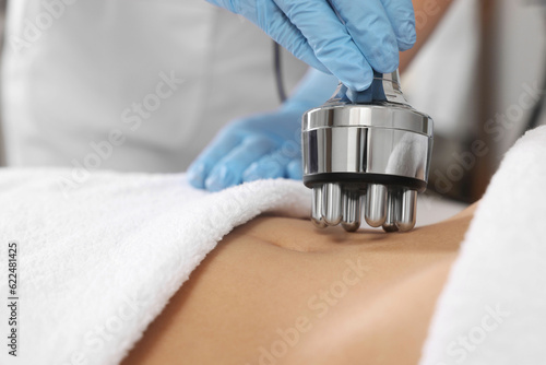 Photos Woman undergoing radio frequency lifting procedure in beauty salon, closeup