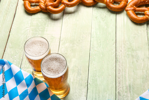 Two glasses of foamy beer a...