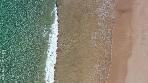 New Zealand Beach, Overhead view of waves crashing over golden sand