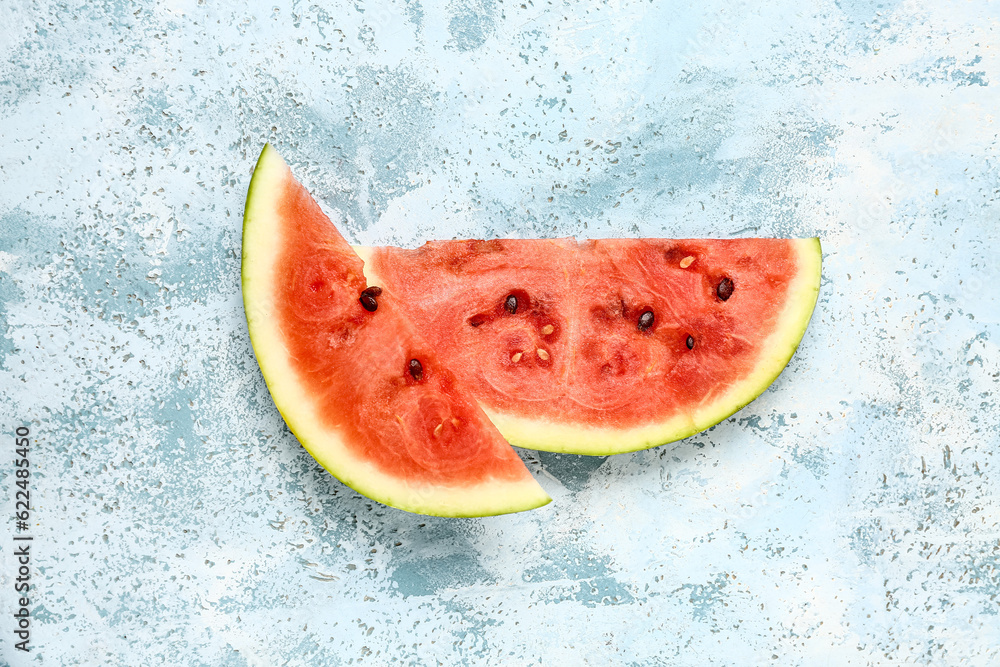 Pieces of fresh watermelon on blue background Pieces of fresh watermelon on blue background