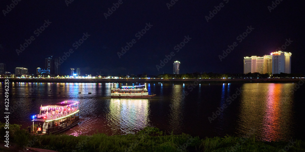 Tourist boats on the Mekong river in the evening in Phnom Penh, Cambodia	