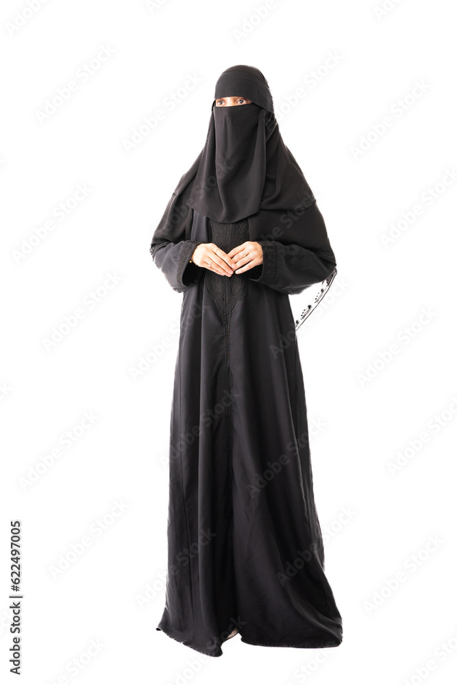 muslim woman wearing a black hijab or niqab and long dress standing in white background holding hands muslim woman wearing a black hijab or niqab and long dress standing in white background holding hands