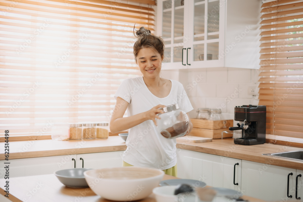 Funny candid moment of asian wife cooking for husband for the first time. Funny candid moment of asian wife cooking for husband for the first time.