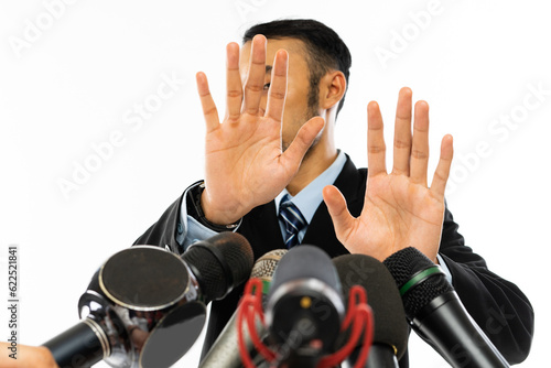 Konstfotografi an adult man in blue shirt and black suit dodged while proffered by several type
