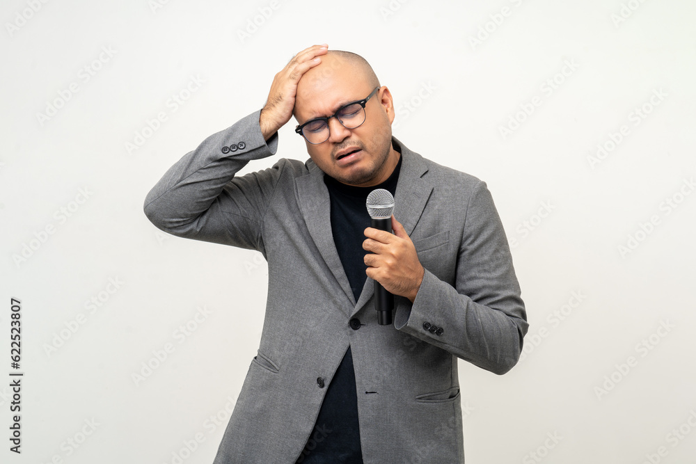 Businessman speaker with high quality dynamic microphone speaking talking with people on isolated white background. Male testing microphone voice for interview. Motivation life coach in training Businessman speaker with high quality dynamic microphone speaking talking with people on isolated white background. Male testing microphone voice for interview. Motivation life coach in training
