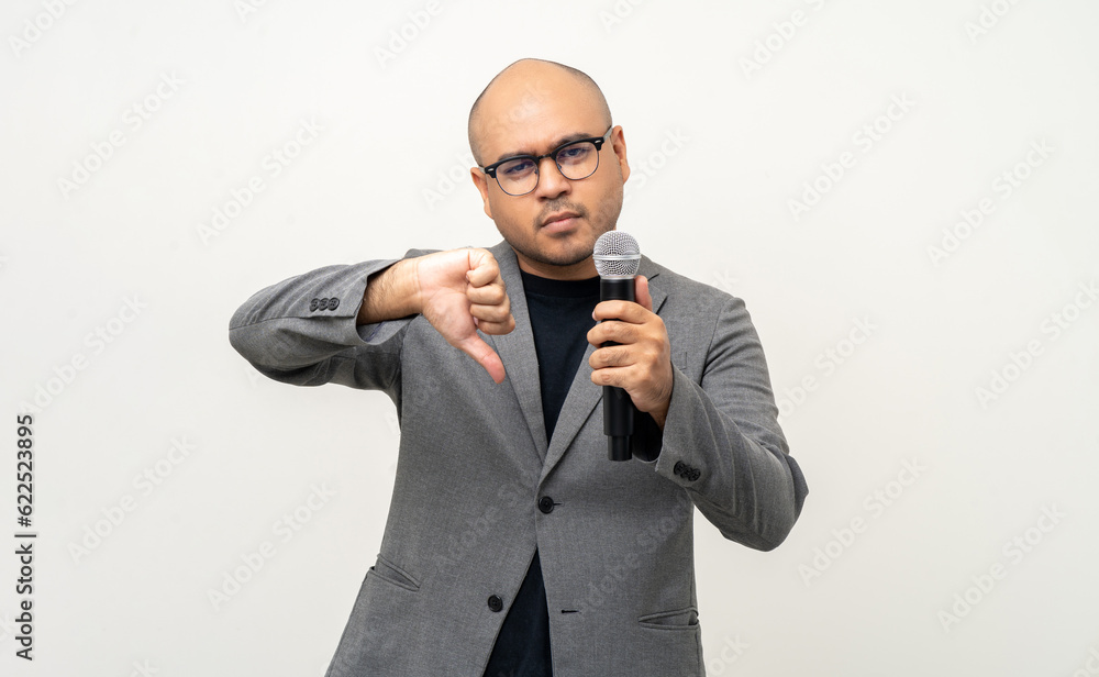 Businessman speaker with high quality dynamic microphone speaking talking with people on isolated white background. Male testing microphone voice for interview. Motivation life coach in training Businessman speaker with high quality dynamic microphone speaking talking with people on isolated white background. Male testing microphone voice for interview. Motivation life coach in training