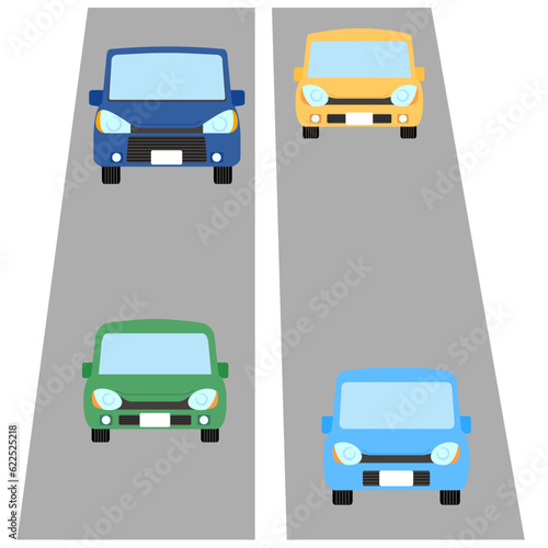 道路を走行している4台の乗用車 © Simao55