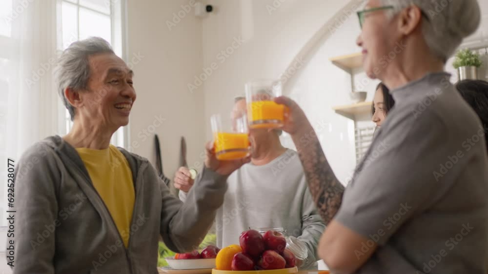 Group of Asian elder people friends making vegetables salad and fruit juice with her daughter in kitchen at home.concept of Group asia senior people Healthy eating,colorful fruits and vegetables. Group of Asian elder people friends making vegetables salad and fruit juice with her daughter in kitchen at home.concept of Group asia senior people Healthy eating,colorful fruits and vegetables.