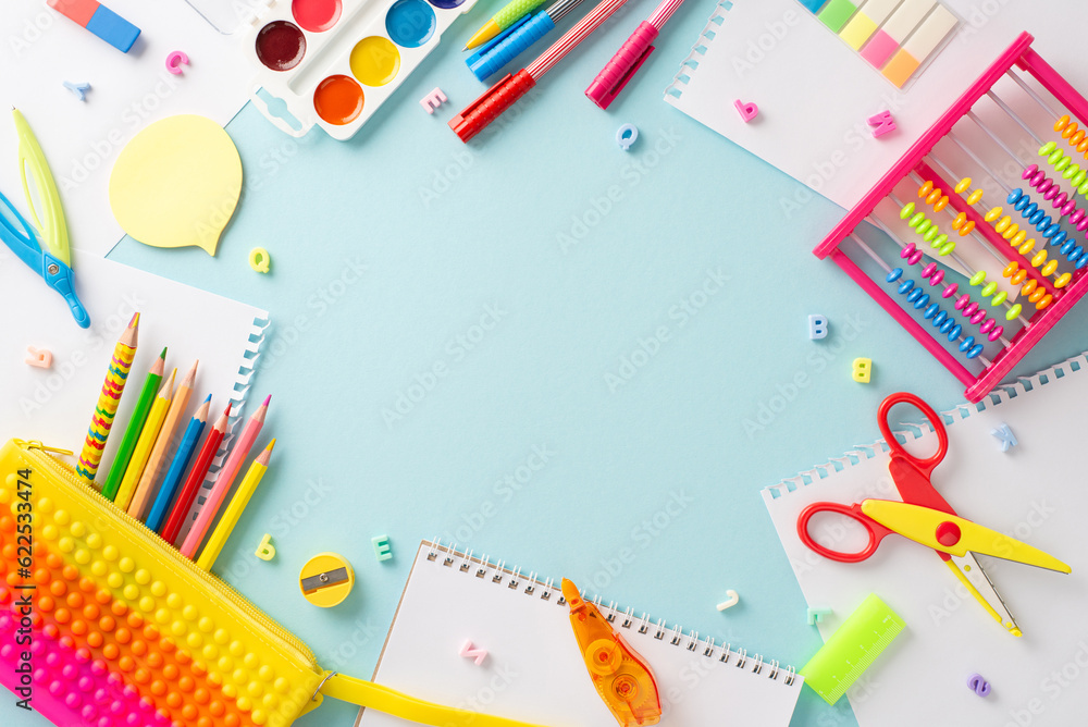 Discover the magic of education for small kids through this captivating top view photo: a charming display of colorful school supplies on an isolated pastel blue backdrop, ready for text or promotions Discover the magic of education for small kids through this captivating top view photo: a charming display of colorful school supplies on an isolated pastel blue backdrop, ready for text or promotions