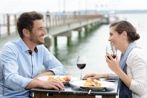 couple on romantic date at sea restaurant