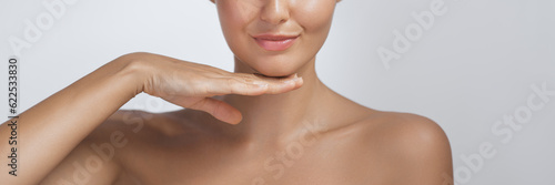 Close-up Perfect Natural Skin Care Beauty Portrait Half Face with Lips Chin and Shoulders  photo