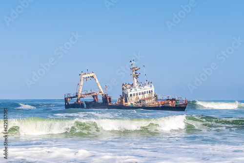 Fototapeta Naklejka Na Ścianę i Meble -  The Zeila Shipwreck on the Namibian skeleton coast in rough seas.