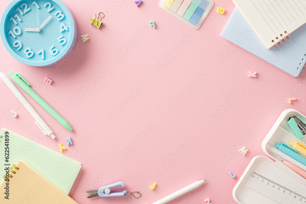 Brighten up your study routine! Top-down view of back-to-school essentials—copybooks, pens, binder clip, clock, alphabet letters—arranged on a pastel pink background. Plenty of space for text or ads Brighten up your study routine! Top-down view of back-to-school essentials—copybooks, pens, binder clip, clock, alphabet letters—arranged on a pastel pink background. Plenty of space for text or ads