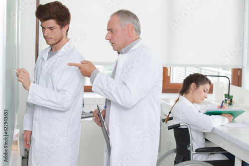 the students in white coats