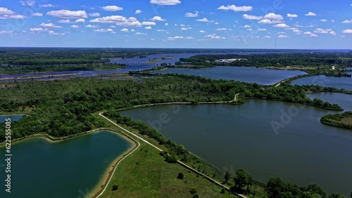 Water lakes surrounded by wooded areas. Aerial drone shot over natural landscape in New Bern, North Carolina photo