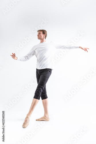 One Young, Handsome, Sporty Athletic Ballet Dancer with Ballanced Hands on White.