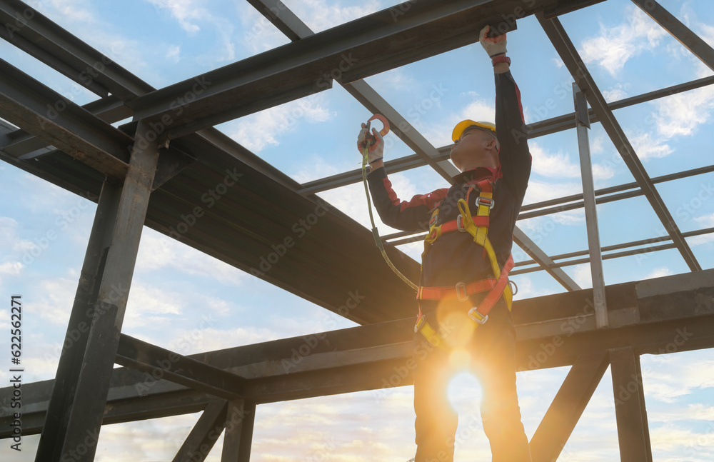 experienced-technicians-in-full-safety-suits-work-at-height-of-steel