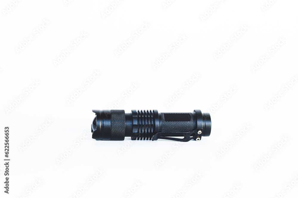 Black tactical flashlight. Outdoor flashlight isolated on white background