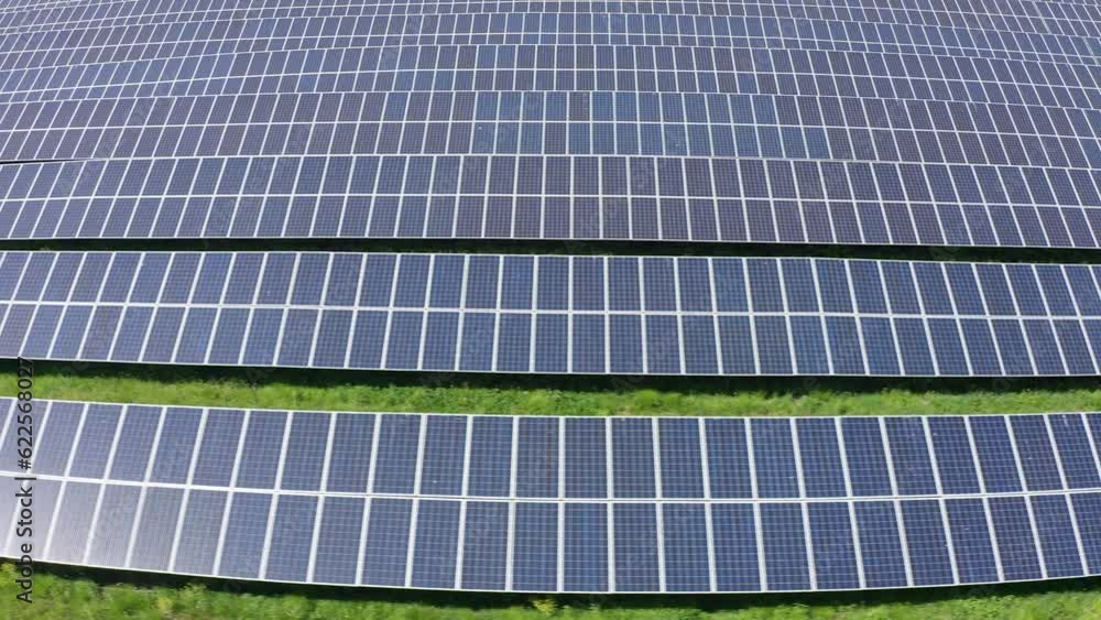 Aerial fast dolly shot across an endless solar farm in rural Minnesota. 4K Aerial fast dolly shot across an endless solar farm in rural Minnesota. 4K