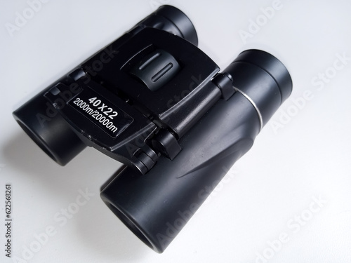 Portable Children's Mini Outdoor Binoculars, Zoom Mini Folding Pocket Binoculars with white isolated background and copy space