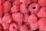 Background, texture of fresh sweet red raspberries