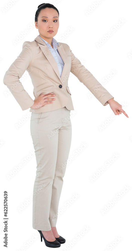 Digital png photo of serious asian businesswoman pointing finger on transparent background Digital png photo of serious asian businesswoman pointing finger on transparent background